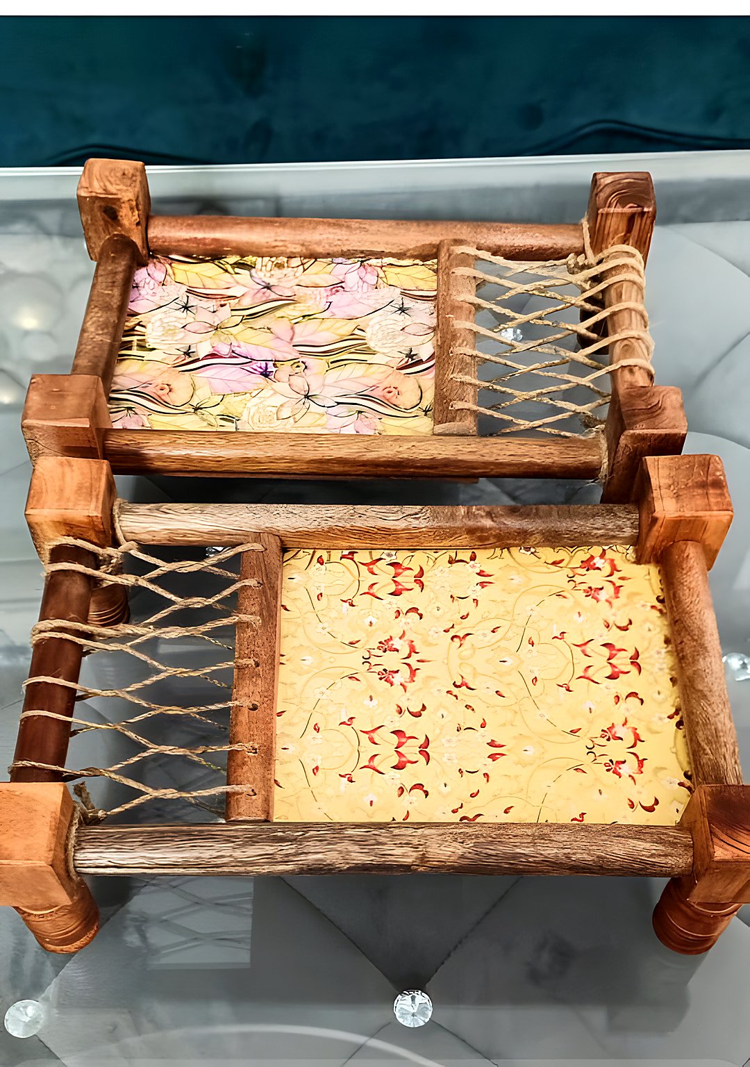 Two wooden charpai serving platters